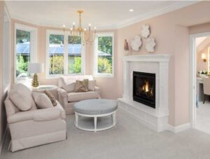 Casement windows in a living room with a fireplace